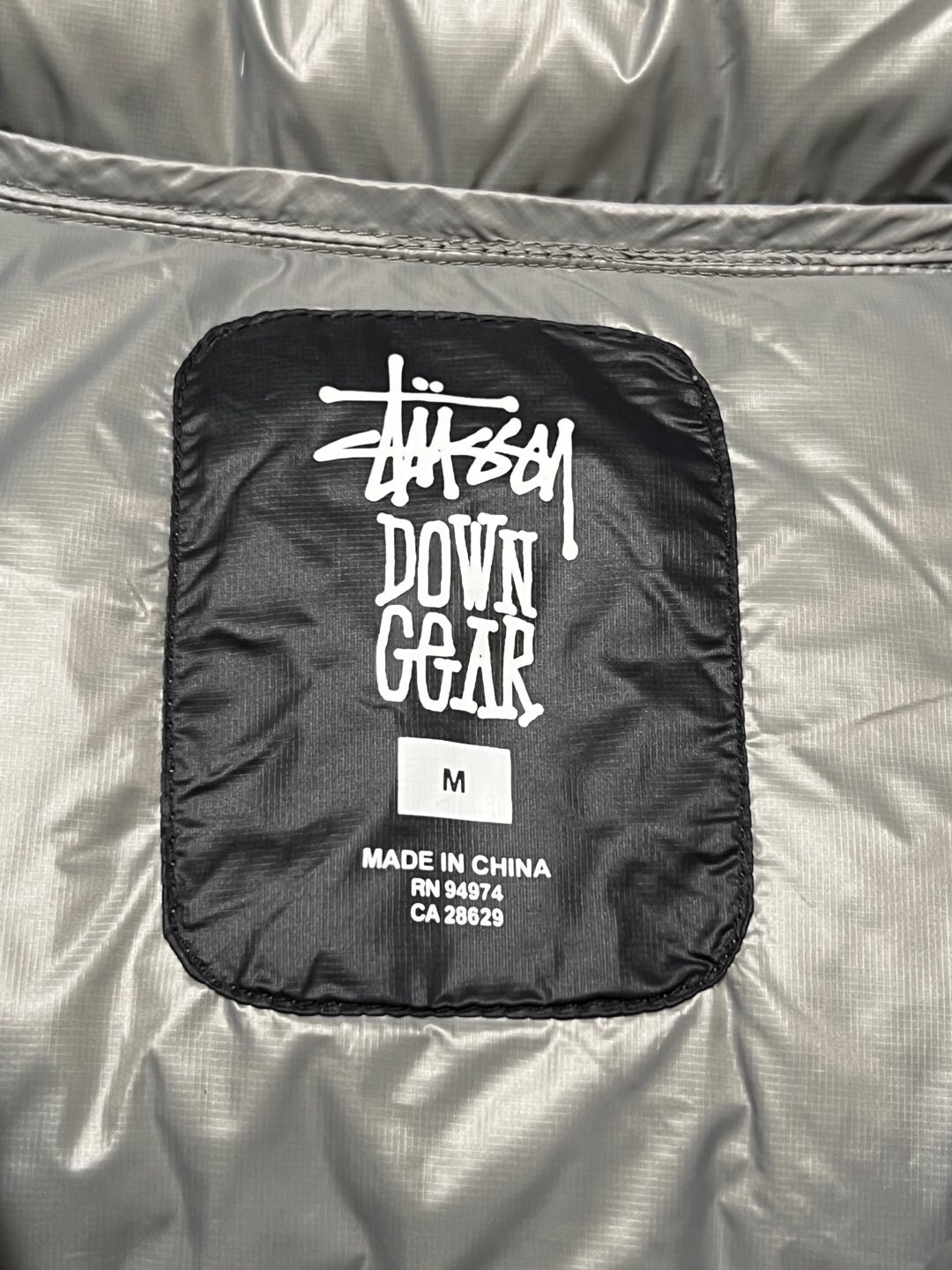 P879  Stussy down jacket · image 20